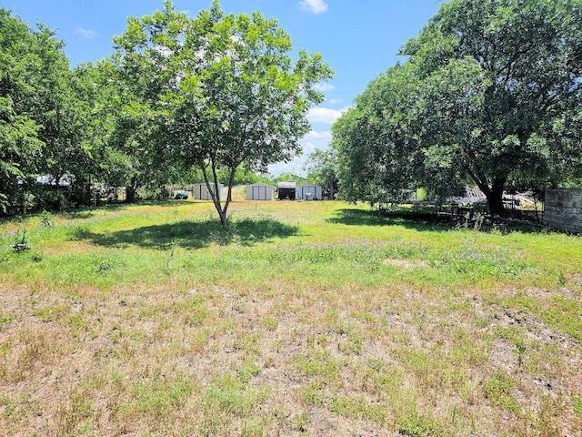 105 Park Dr S, Kyle, TX 78640 - view of yard featuring an outdoor structure