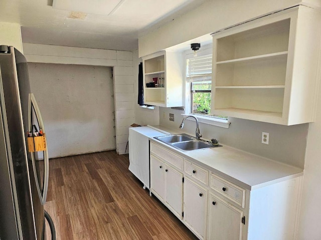 105 Park Dr S, Kyle, TX 78640 - kitchen featuring freestanding refrigerator, a sink, dark wood-type flooring, open shelves, and white cabinets