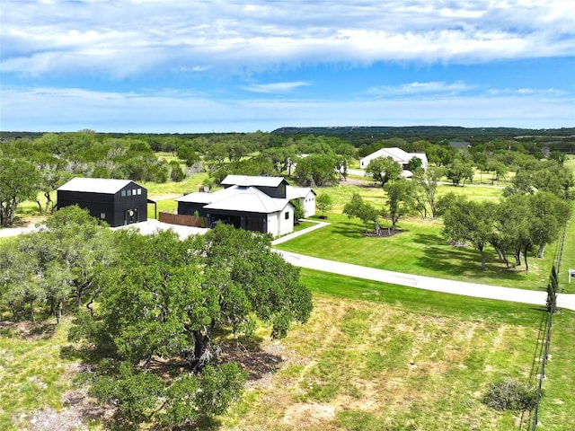 150 Wandering Oak Cir, Burnet, TX 78611 - aerial view of property and surrounding area featuring a heavily wooded area
