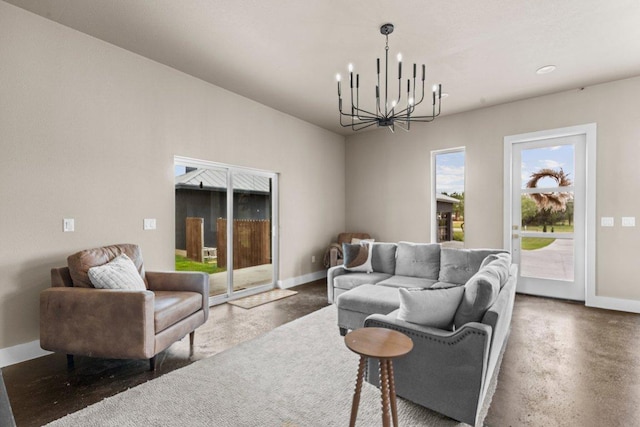 150 Wandering Oak Cir, Burnet, TX 78611 - living room featuring a chandelier and baseboards