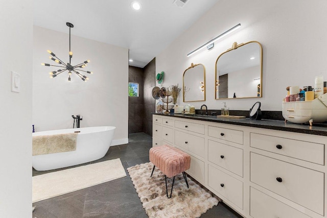 150 Wandering Oak Cir, Burnet, TX 78611 - bathroom with vanity, a freestanding tub, recessed lighting, a walk in shower, and a chandelier