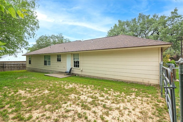 926 Zwicke St, Seguin, TX 78155 - back of house with a patio and roof with shingles