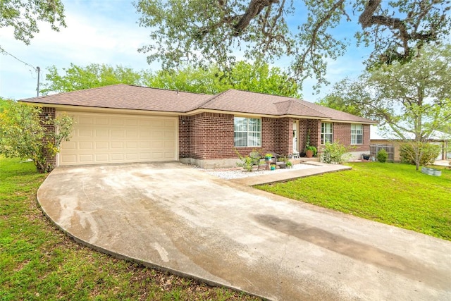 926 Zwicke St, Seguin, TX 78155 - view of front of home featuring driveway, a garage, a front yard, and brick siding