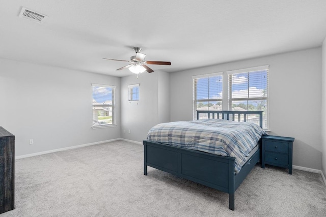 529 Cinnamon Teal Ln, Leander, TX 78641 - bedroom featuring light colored carpet, baseboards, and a ceiling fan