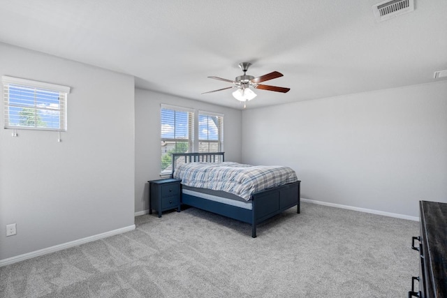 529 Cinnamon Teal Ln, Leander, TX 78641 - bedroom featuring multiple windows, light carpet, and ceiling fan