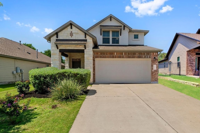 529 Cinnamon Teal Ln, Leander, TX 78641 - view of front of property featuring brick siding, an attached garage, a standing seam roof, stone siding, and concrete driveway