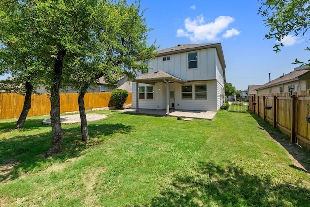 529 Cinnamon Teal Ln, Leander, TX 78641 - back of house with board and batten siding, a patio, and a fenced backyard
