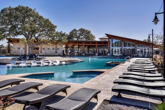 529 Cinnamon Teal Ln, Leander, TX 78641 - community pool with a jacuzzi and a patio area