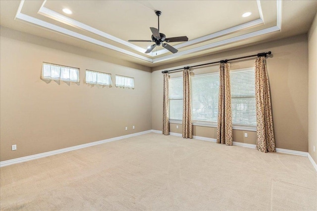 118 NE Verrena Way, Georgetown, TX 78628 - unfurnished room with a tray ceiling, light colored carpet, ceiling fan, ornamental molding, and recessed lighting