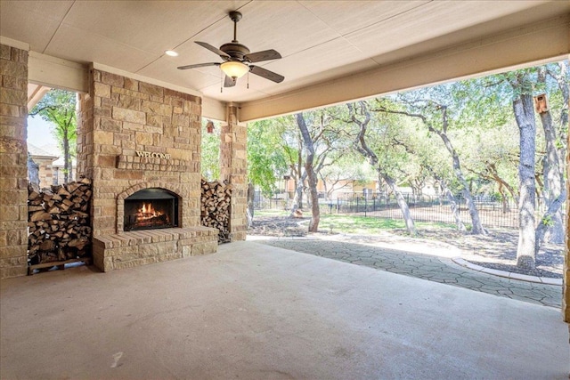 118 NE Verrena Way, Georgetown, TX 78628 - view of patio featuring an outdoor stone fireplace and ceiling fan