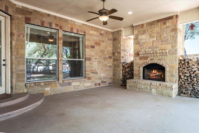 118 NE Verrena Way, Georgetown, TX 78628 - view of patio / terrace with an outdoor stone fireplace and ceiling fan
