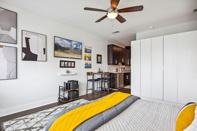 3114 S Congress Ave Unit 304, Austin, TX 78704 - bedroom with dark wood-style floors and baseboards