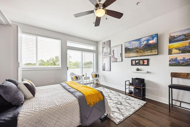 3114 S Congress Ave Unit 304, Austin, TX 78704 - bedroom with wood finished floors, baseboards, and ceiling fan