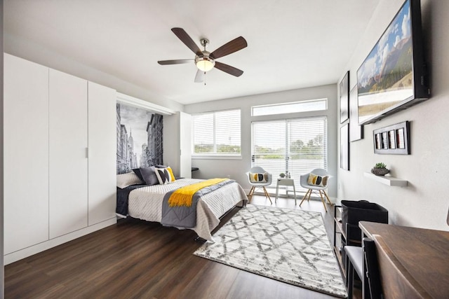 3114 S Congress Ave Unit 304, Austin, TX 78704 - bedroom featuring dark wood finished floors and ceiling fan