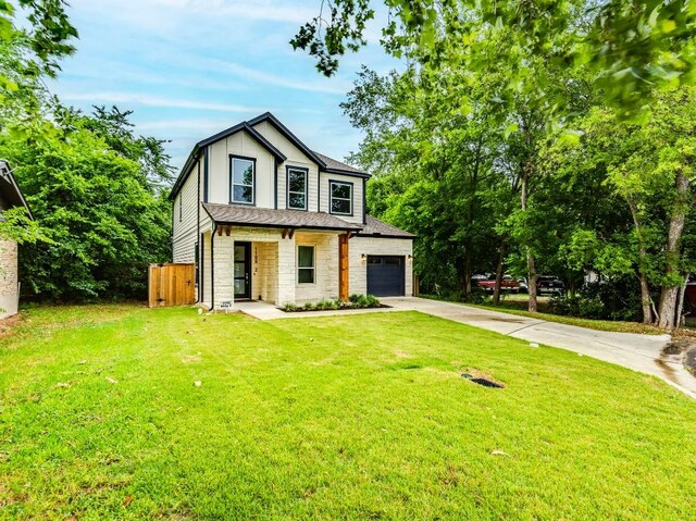 1108 Floradale Dr, Austin, TX 78753 - view of front of home featuring stone siding, driveway, a porch, and an attached garage