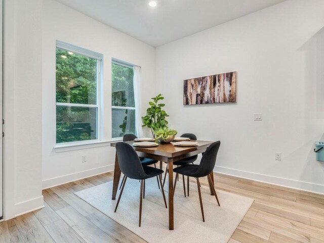 1108 Floradale Dr, Austin, TX 78753 - dining space featuring baseboards and light wood-type flooring