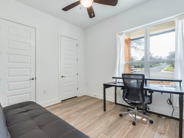1108 Floradale Dr, Austin, TX 78753 - home office featuring light wood finished floors, ceiling fan, and baseboards