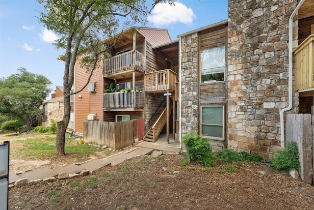 6903 Deatonhill Dr Unit 15, Austin, TX 78745 - back of property featuring stone siding and stairway