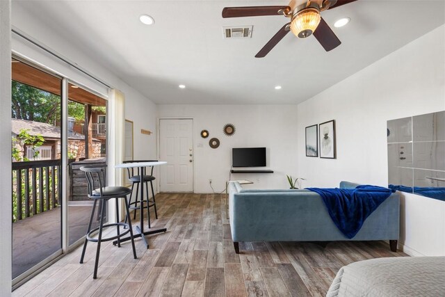 6903 Deatonhill Dr Unit 15, Austin, TX 78745 - living room featuring wood finished floors, ceiling fan, and recessed lighting