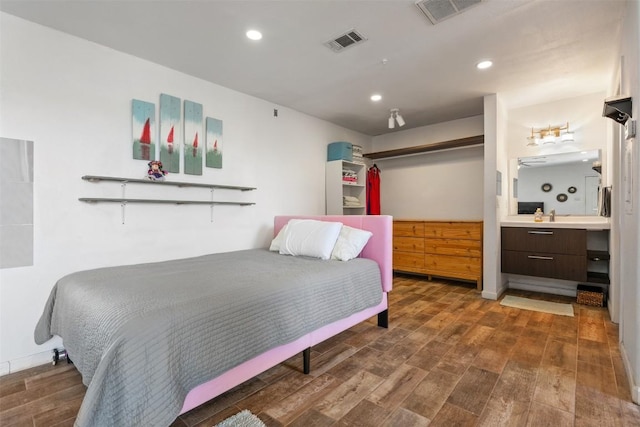6903 Deatonhill Dr Unit 15, Austin, TX 78745 - bedroom with wood finished floors and recessed lighting