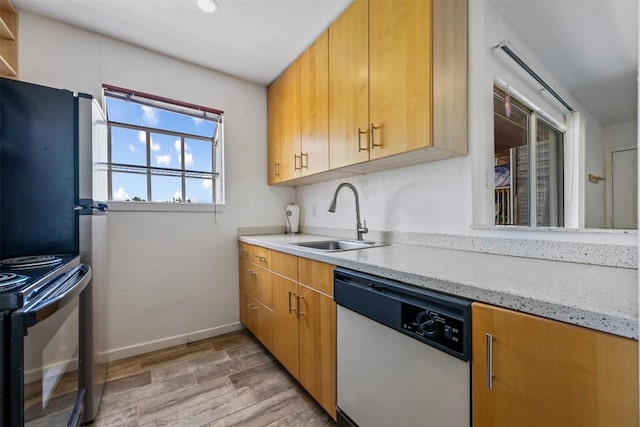 6903 Deatonhill Dr Unit 15, Austin, TX 78745 - kitchen with dishwashing machine, light wood-style floors, light stone countertops, and black / electric stove