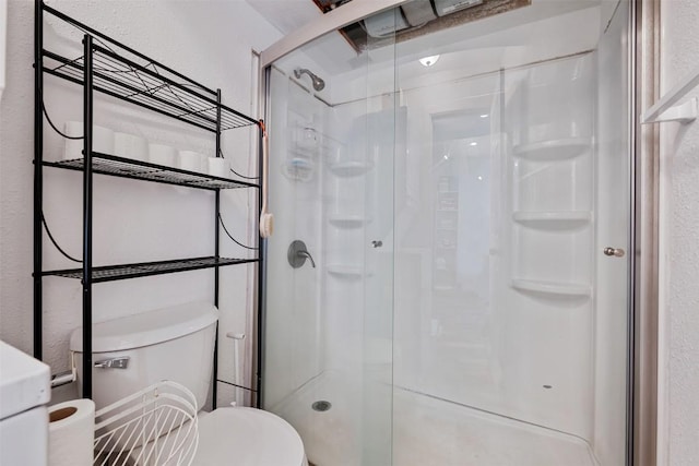 6903 Deatonhill Dr Unit 15, Austin, TX 78745 - full bathroom with a shower stall, toilet, and a textured wall