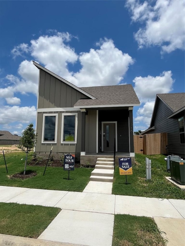 316 Witchhazel Way, San Marcos, TX 78666 - view of front facade with board and batten siding and a shingled roof