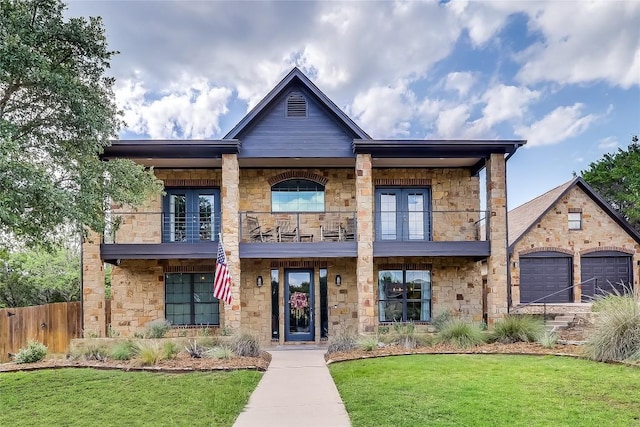 20502 Greeley Cv, Lago Vista, TX 78645 - view of front of house featuring a balcony, stone siding, french doors, and an attached garage