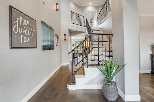20502 Greeley Cv, Lago Vista, TX 78645 - stairs with wood finished floors, crown molding, and a high ceiling