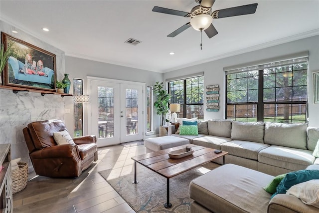 20502 Greeley Cv, Lago Vista, TX 78645 - living room featuring french doors, ornamental molding, wood finished floors, ceiling fan, and recessed lighting