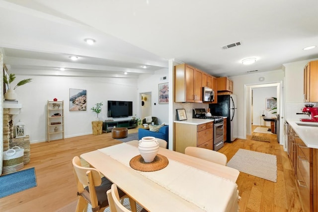 5202 Hedgewood Dr, Austin, TX 78745 - dining space featuring light wood finished floors, baseboards, and recessed lighting