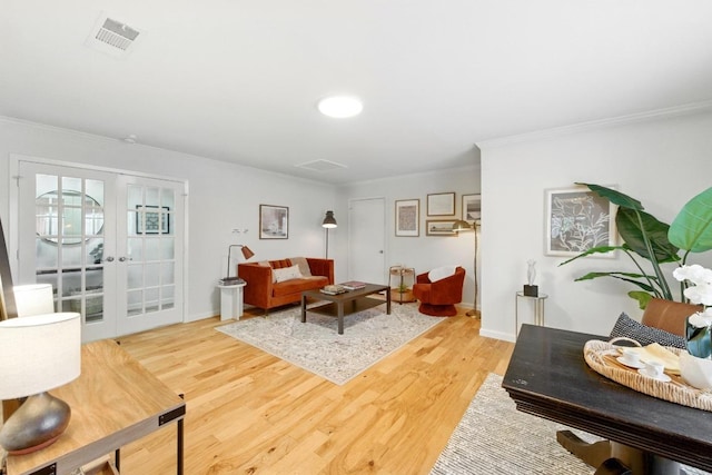 5202 Hedgewood Dr, Austin, TX 78745 - living area with french doors, ornamental molding, wood finished floors, and baseboards