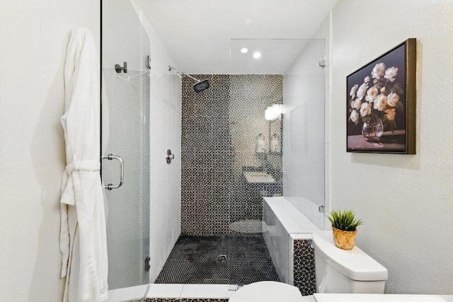 5202 Hedgewood Dr, Austin, TX 78745 - full bathroom featuring toilet, a stall shower, tile patterned floors, and recessed lighting
