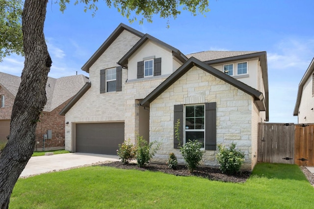 4356 Mayfield Ranch Blvd, Round Rock, TX 78681 - view of front of house featuring stone siding, concrete driveway, a gate, an attached garage, and roof with shingles