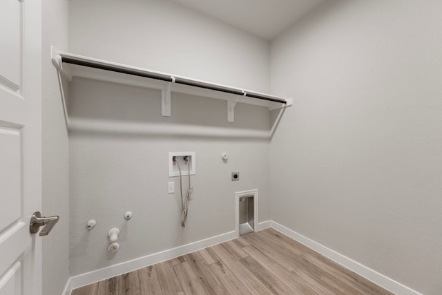 4356 Mayfield Ranch Blvd, Round Rock, TX 78681 - laundry room featuring hookup for a gas dryer, hookup for a washing machine, hookup for an electric dryer, light wood-style floors, and baseboards