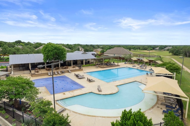 4356 Mayfield Ranch Blvd, Round Rock, TX 78681 - community pool with a patio and view of wooded area