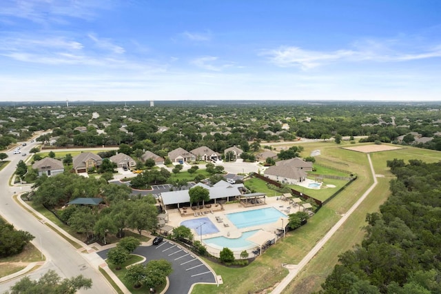4356 Mayfield Ranch Blvd, Round Rock, TX 78681 - drone / aerial view of a pool area and a tree filled landscape