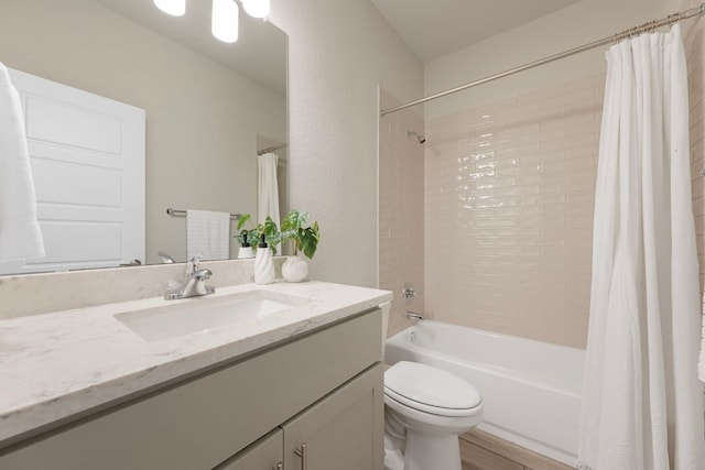 4356 Mayfield Ranch Blvd, Round Rock, TX 78681 - bathroom featuring vanity, toilet, shower / bath combo with shower curtain, and wood finished floors