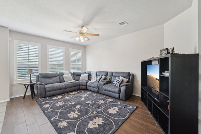 4013 Veiled Falls Dr, Pflugerville, TX 78660 - living area featuring a ceiling fan, wood finished floors, and baseboards