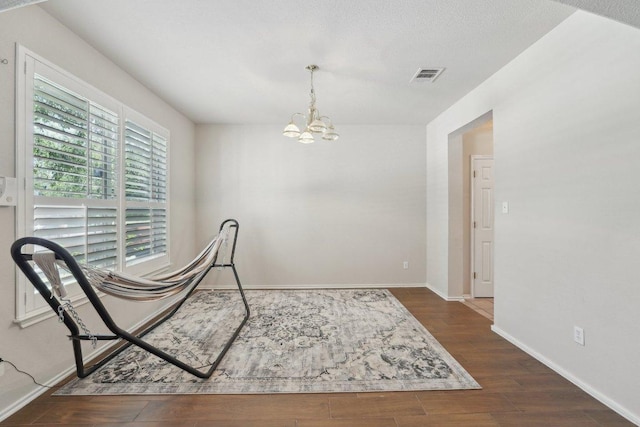 4013 Veiled Falls Dr, Pflugerville, TX 78660 - dining space with a chandelier, wood finished floors, and baseboards