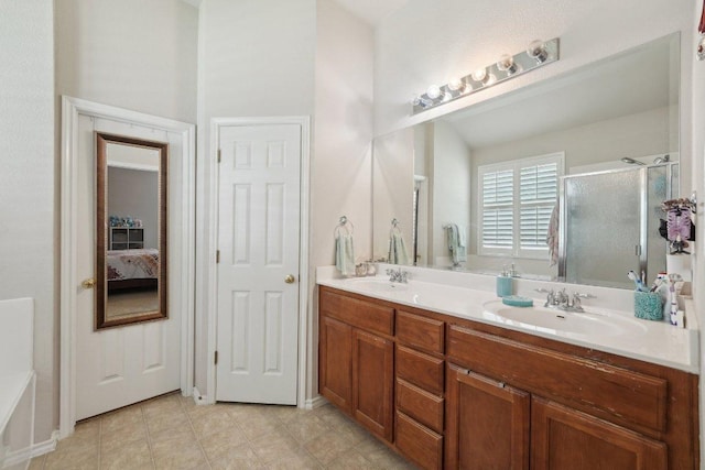4013 Veiled Falls Dr, Pflugerville, TX 78660 - ensuite bathroom featuring a stall shower, double vanity, tile patterned flooring, and a bathtub