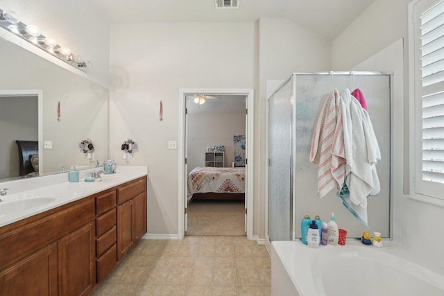 4013 Veiled Falls Dr, Pflugerville, TX 78660 - full bathroom with connected bathroom, double vanity, a shower stall, a garden tub, and vaulted ceiling