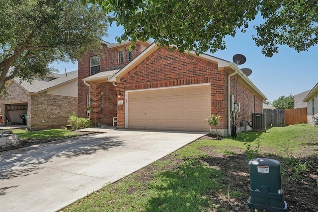 4013 Veiled Falls Dr, Pflugerville, TX 78660 - traditional-style home featuring a garage, central AC unit, driveway, and brick siding