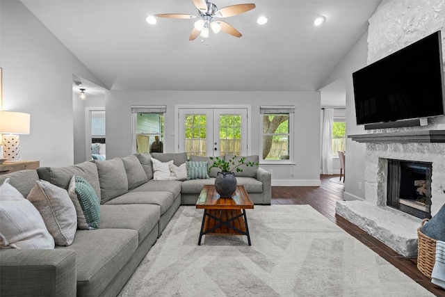 12420 Cassady Dr, Austin, TX 78727 - living room with ceiling fan, a fireplace, wood finished floors, recessed lighting, and french doors