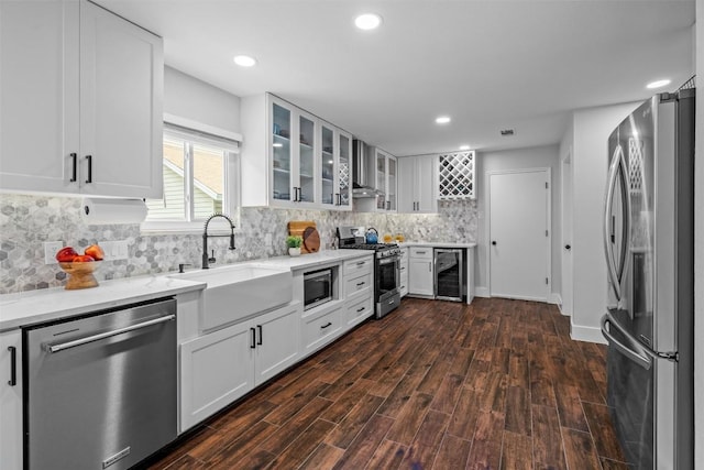 12420 Cassady Dr, Austin, TX 78727 - kitchen featuring stainless steel appliances, wine cooler, a sink, dark wood-type flooring, and white cabinets