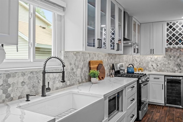 12420 Cassady Dr, Austin, TX 78727 - kitchen with wine cooler, a sink, stainless steel appliances, and glass insert cabinets