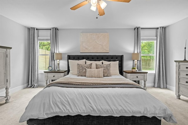 12420 Cassady Dr, Austin, TX 78727 - bedroom with light colored carpet, baseboards, and ceiling fan