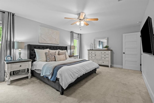 12420 Cassady Dr, Austin, TX 78727 - bedroom featuring light colored carpet, a ceiling fan, and baseboards