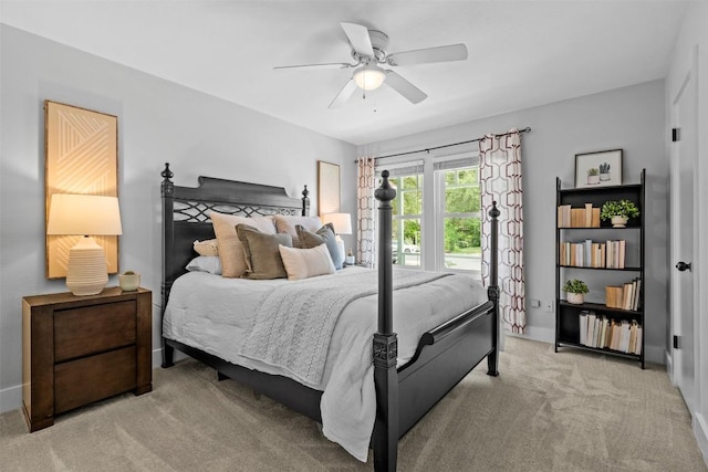 12420 Cassady Dr, Austin, TX 78727 - bedroom with light carpet, baseboards, and ceiling fan