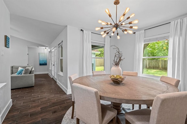 12420 Cassady Dr, Austin, TX 78727 - dining space with a chandelier, dark wood-style flooring, baseboards, and vaulted ceiling